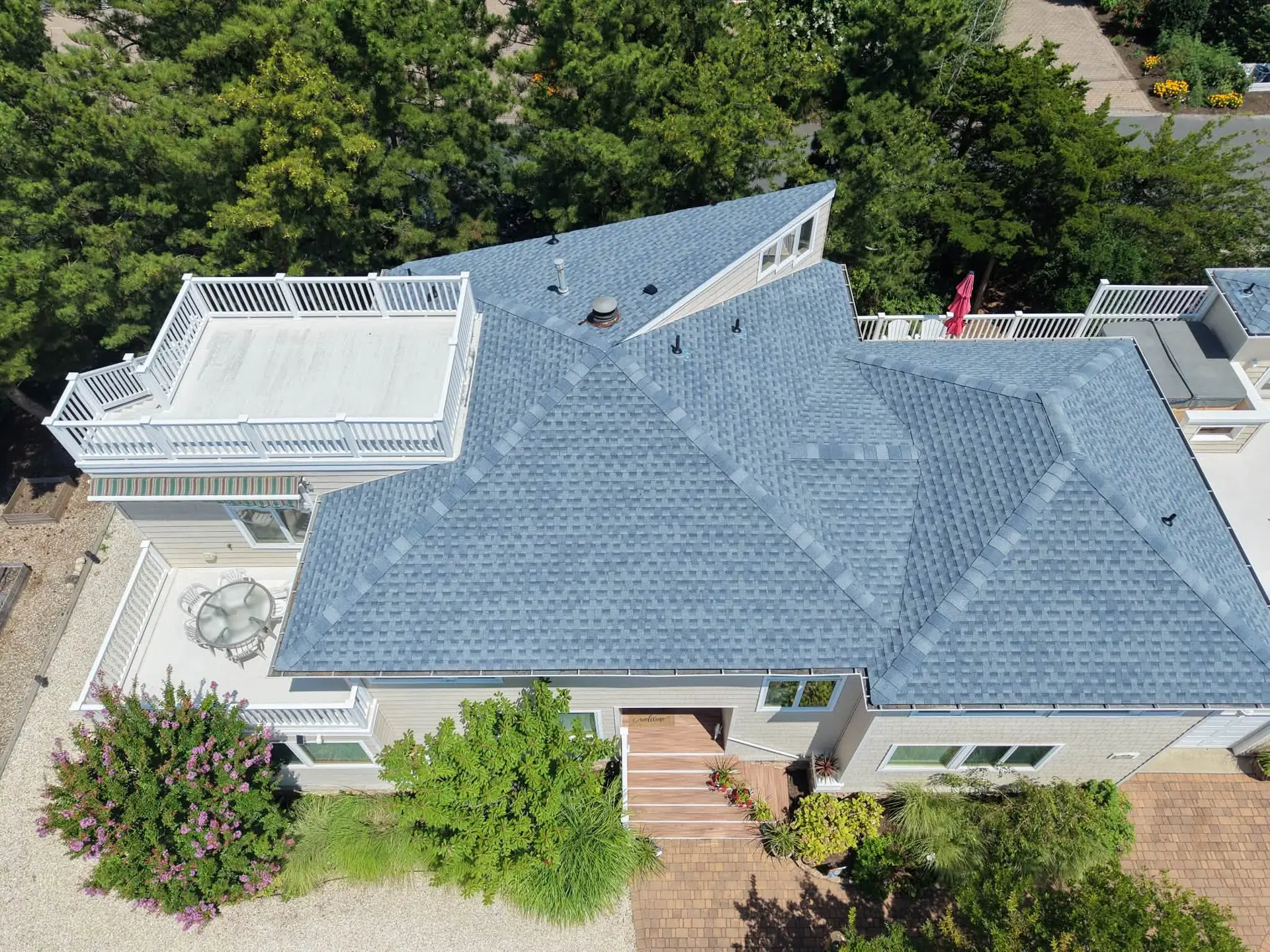 Aerial view of a completed asphalt shingle roof replacement